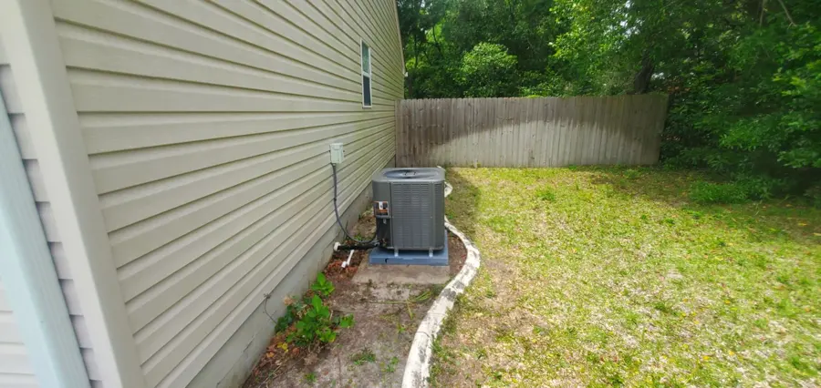 Outdoor condenser beside a house